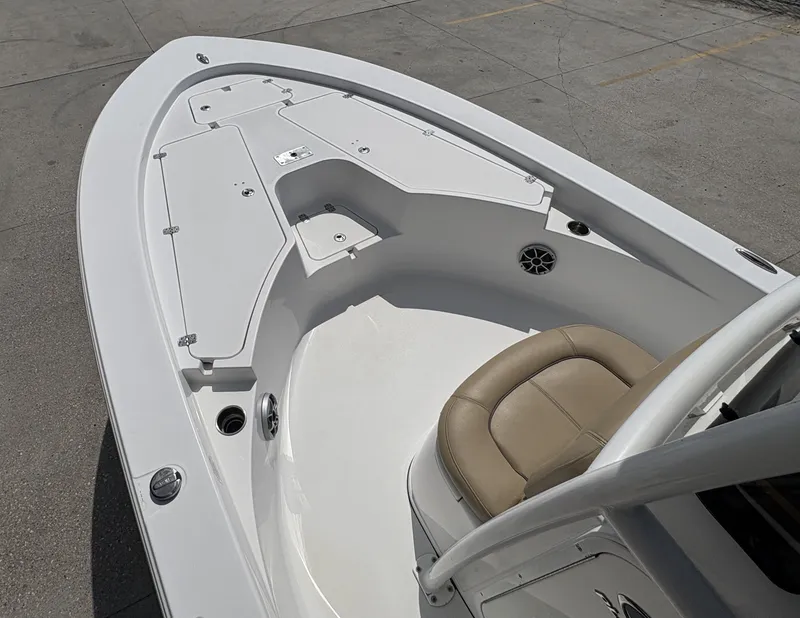 Slide: The Image of 2016 Sportsman Masters 247 Bay Boat interior with helm, seating, and controls. - 9
