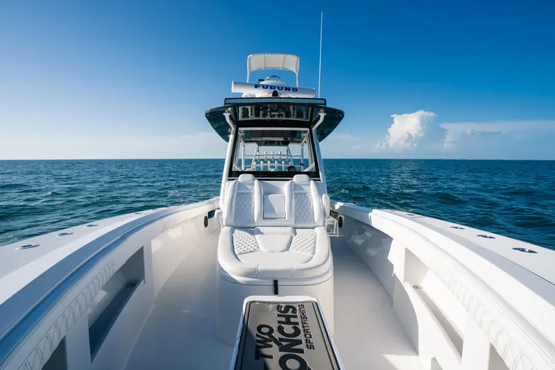 Slide: The Image of 2023 Front Runner 39 Center Console boat on open sea under clear blue sky. - 10