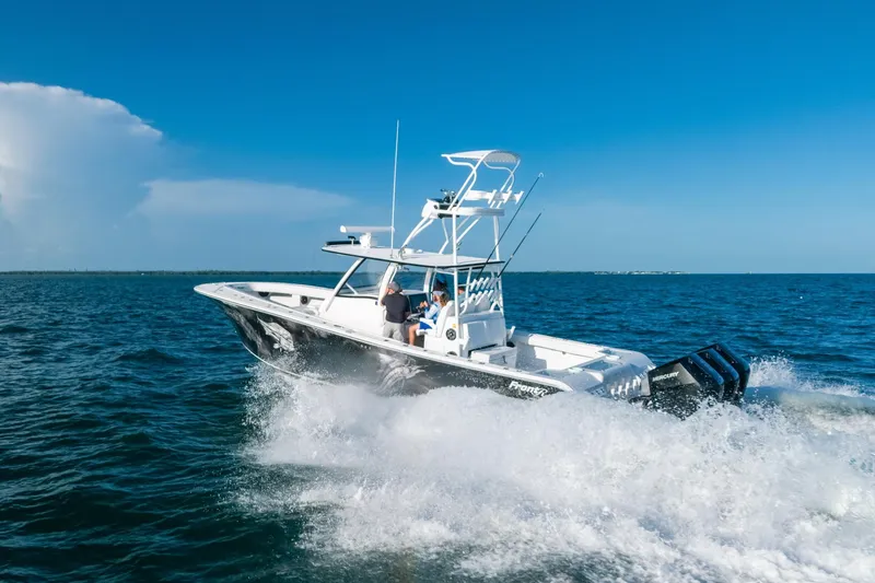 Slide: The Image of 2023 Front Runner 39 Center Console boat cruising on open water under clear blue sky. - 15