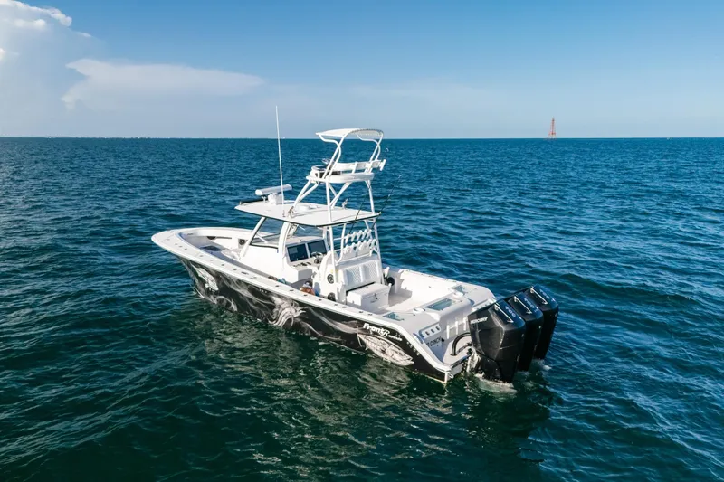 Slide: The Image of 2023 Front Runner 39 Center Console boat on open sea with clear blue sky. - 2