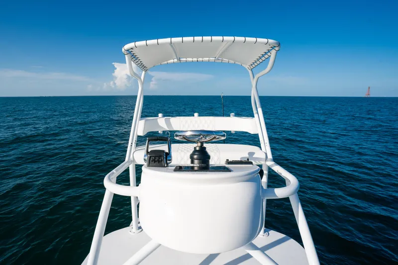 Slide: The Image of 2023 Front Runner 39 Center Console boat on open ocean, clear blue sky. - 23