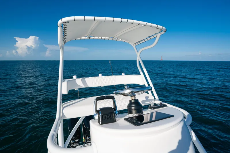 Slide: The Image of 2023 Front Runner 39 Center Console boat on open ocean under clear blue sky. - 24