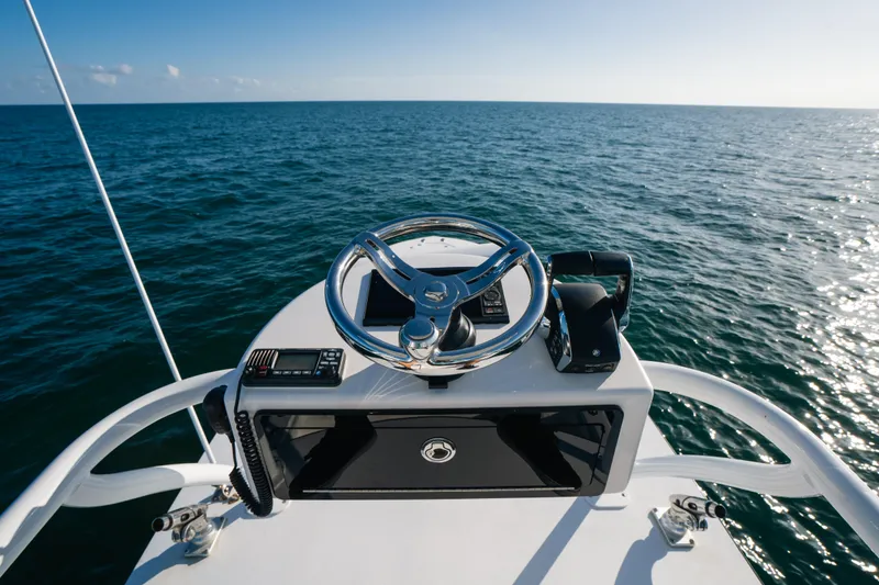 Slide: The Image of 2023 Front Runner 39 Center Console helm overlooking the ocean. - 25