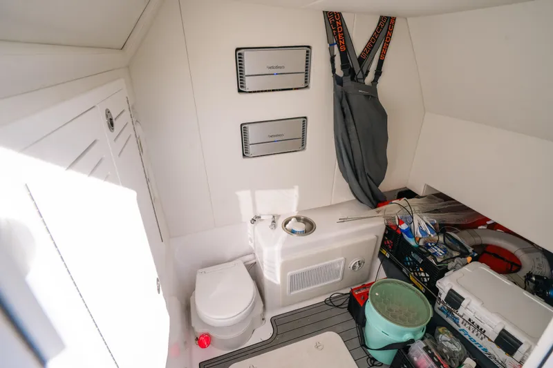 Slide: The Image of Interior of 2023 Front Runner 39 Center Console boat with storage and equipment. - 27