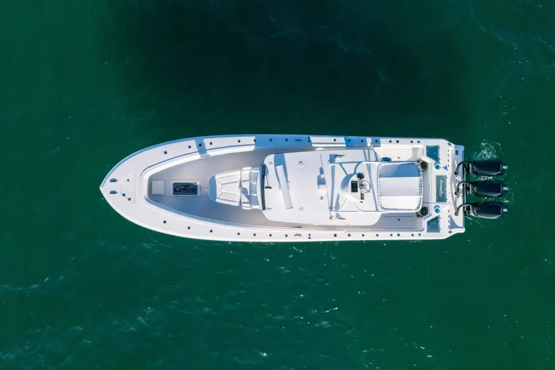 Slide: The Image of Aerial view of 2023 Front Runner 39 Center Console boat on green water. - 3