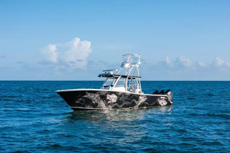 Slide: The Image of 2023 Front Runner 39 Center Console boat on open ocean under clear blue sky. - 31