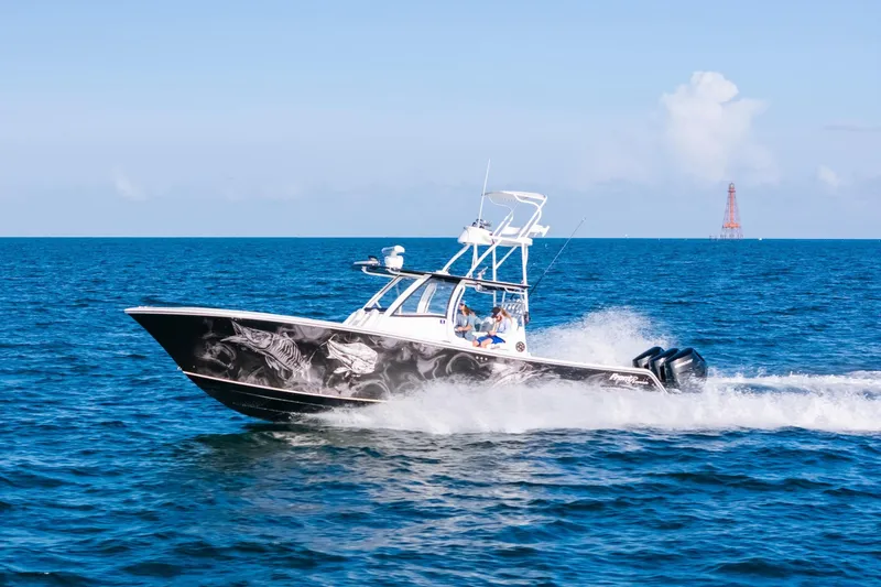 Slide: The Image of 2023 Front Runner 39 Center Console boat cruising on open ocean. - 32
