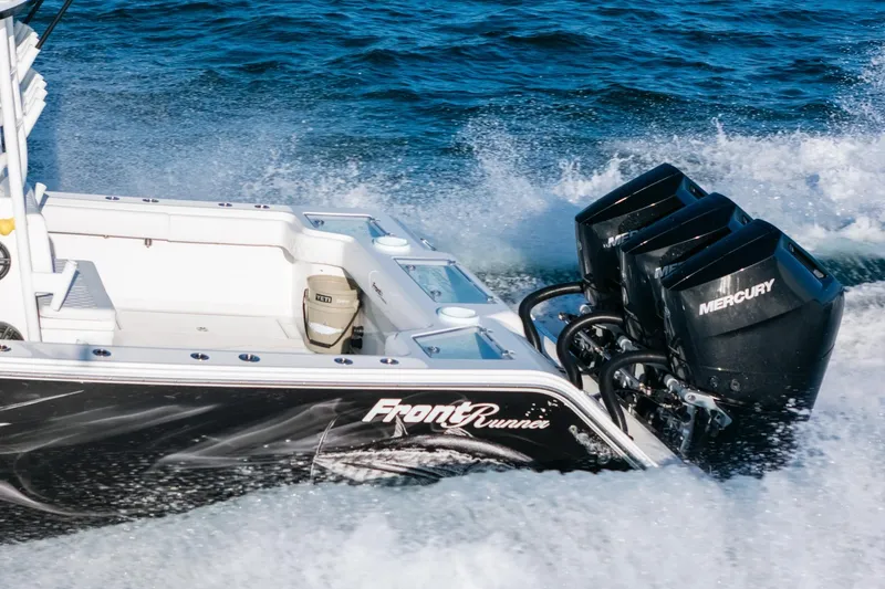 Slide: The Image of 2023 Front Runner 39 Center Console boat with Mercury engines on ocean water. - 6