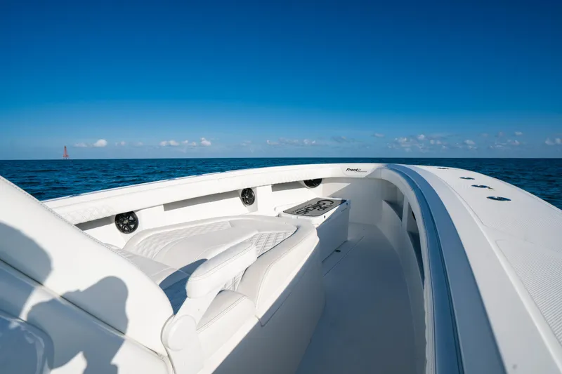 Slide: The Image of 2023 Front Runner 39 Center Console boat on open sea under clear blue sky. - 9