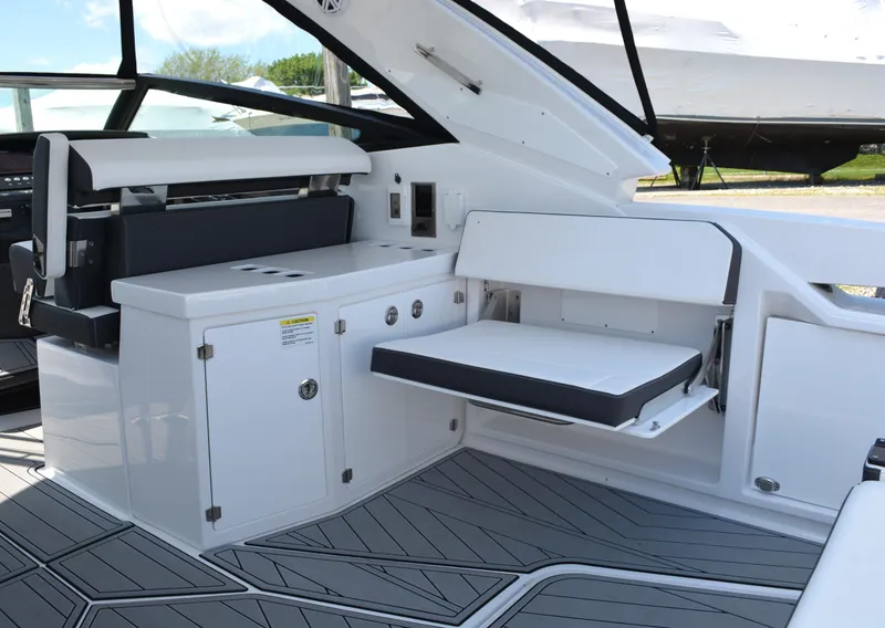 Slide: The Image of 2024 Monterey 378 Super Sport boat interior with seating and storage compartments. - 10