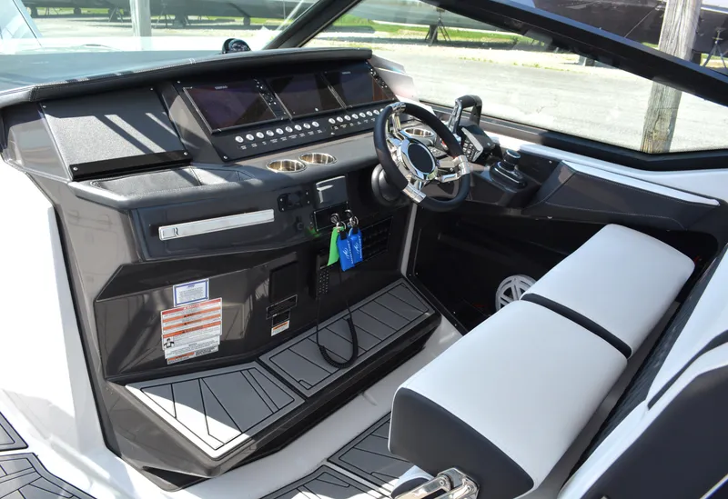 Slide: The Image of 2024 Monterey 378 Super Sport boat cockpit with modern dashboard and steering wheel. - 12