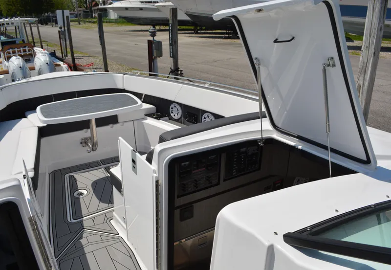 Slide: The Image of 2024 Monterey 378 Super Sport boat interior with open hatch and control panel. - 16