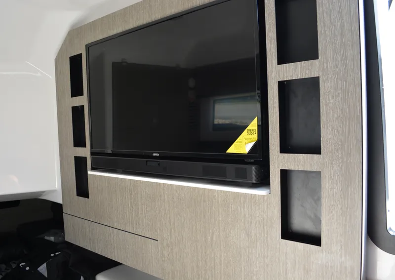 Slide: The Image of 2024 Monterey 378 Super Sport interior with mounted flat-screen TV. - 18