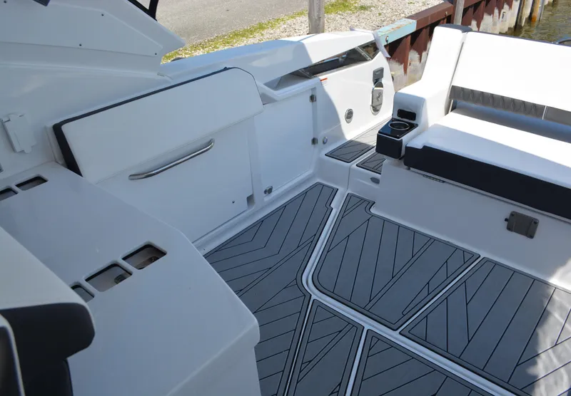 Slide: The Image of 2024 Monterey 378 Super Sport boat interior with modern seating and flooring. - 24