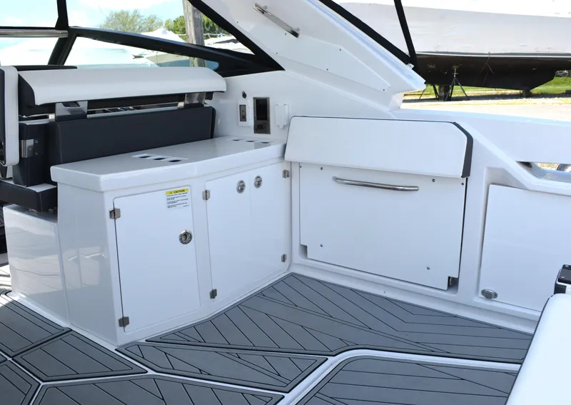 Slide: The Image of 2024 Monterey 378 Super Sport boat interior with white cabinetry and modern design. - 9