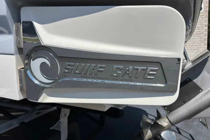 Slide: The Image of 2021 Chaparral 23 Surf boat with Surf Gate feature for enhanced wake surfing. - 5