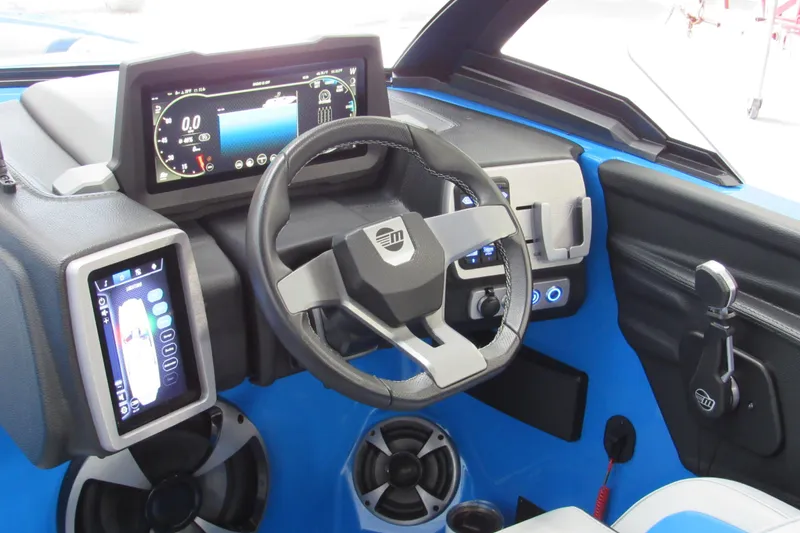 Slide: The Image of 2021 Malibu Wakesetter 21 MLX dashboard with modern controls and touchscreen displays. - 9