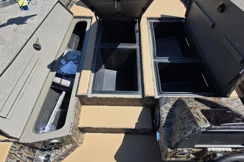 Slide: The Image of 2026 Xpress H20 Bass boat interior storage compartments and seating area. - 16