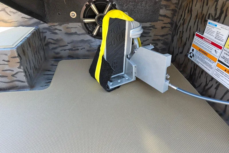 Slide: The Image of Foot pedal mechanism in 2026 Xpress H20 Bass boat interior. - 24