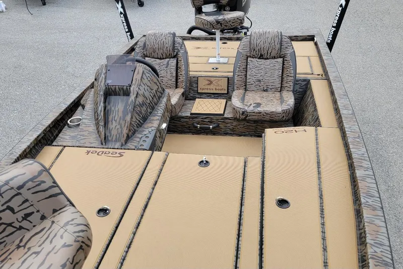 Slide: The Image of 2026 Xpress H20 Bass boat with camouflage interior and seating. - 5