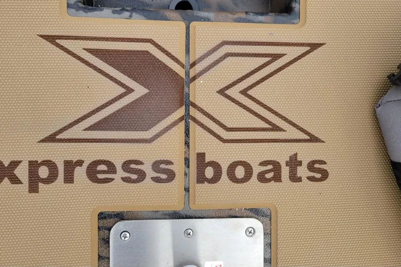 Slide: The Image of 2026 Xpress H20 Bass boat deck with logo and textured surface. - 9