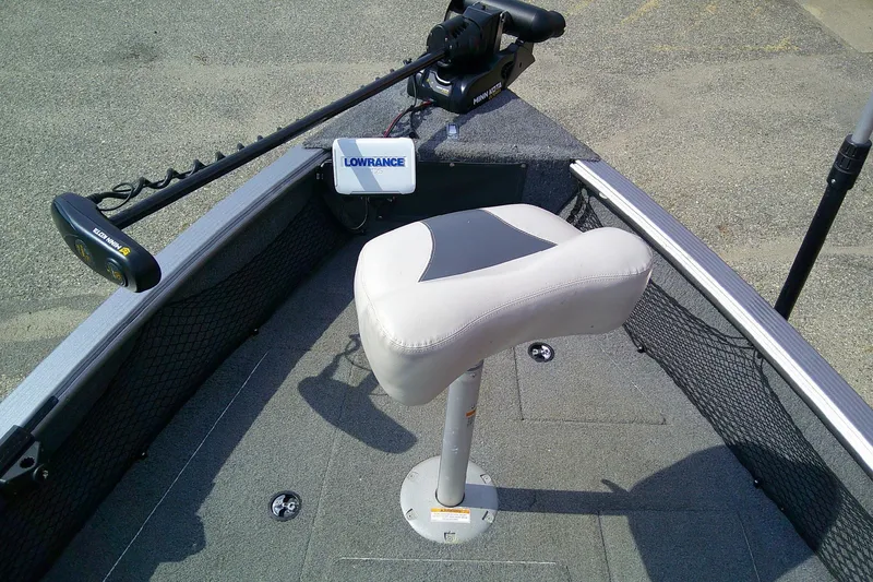 Slide: The Image of 2016 Lund 2025 Impact boat interior with Lowrance equipment and Minn Kota trolling motor. - 10