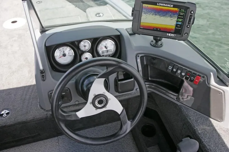 Slide: The Image of Manufacturer Provided Image: 2016 Lund 2025 Impact boat dashboard with steering wheel and Lowrance HDS fishfinder. - 14