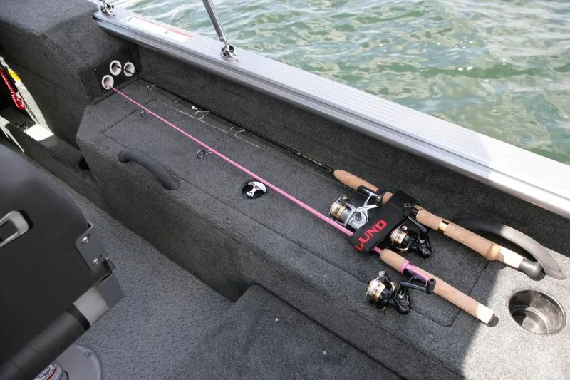 Slide: The Image of Manufacturer Provided Image: Fishing rods on a 2016 Lund 2025 Impact boat. - 16