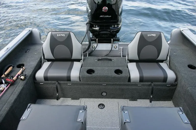 Slide: The Image of Manufacturer Provided Image: 2016 Lund 2025 Impact boat interior with dual seats and fishing rod holders. - 17