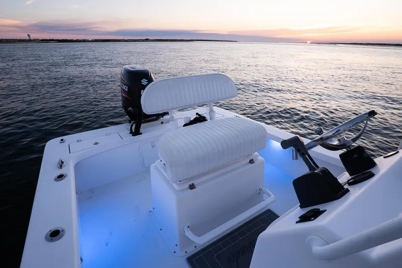 Slide: The Image of 2016 Intruder 198 Tunnel Drive boat at sunset on calm waters. - 18