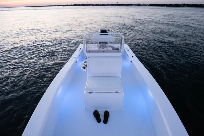 Slide: The Image of Intruder 198 Tunnel Drive boat on calm water at sunset, 2016 model. - 23