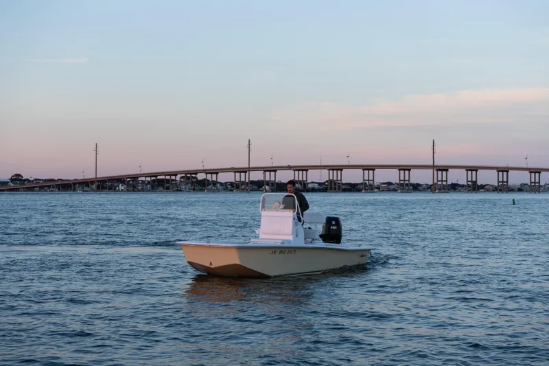 Slide: The Image of Boat on water near bridge at sunset, Intruder 198 Tunnel Drive, 2016 model. - 3