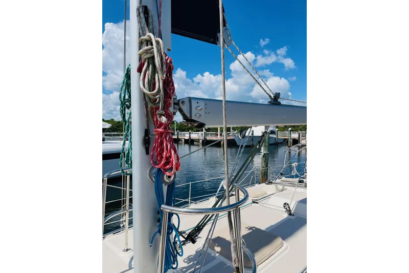 Slide: The Image of Sailboat rigging on 2002 Island Packet 420, docked under a clear blue sky. - 17