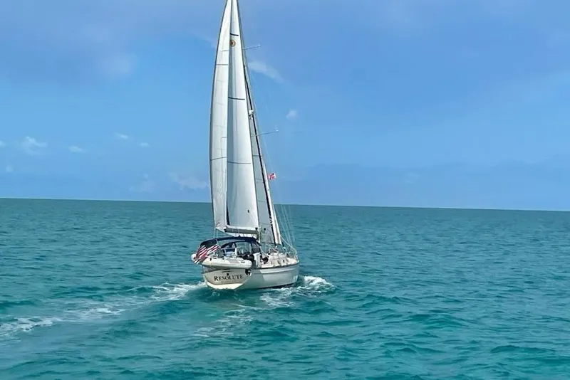Slide: The Image of Sailing yacht Island Packet 420, 2002 model, cruising on open blue sea. - 2