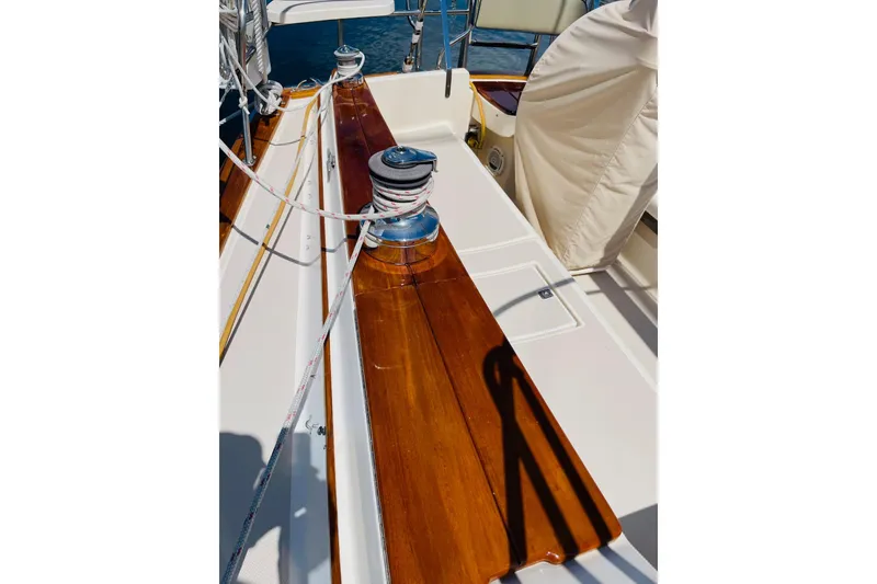 Slide: The Image of Polished deck of 2002 Island Packet 420 sailboat with winch and ropes. - 21
