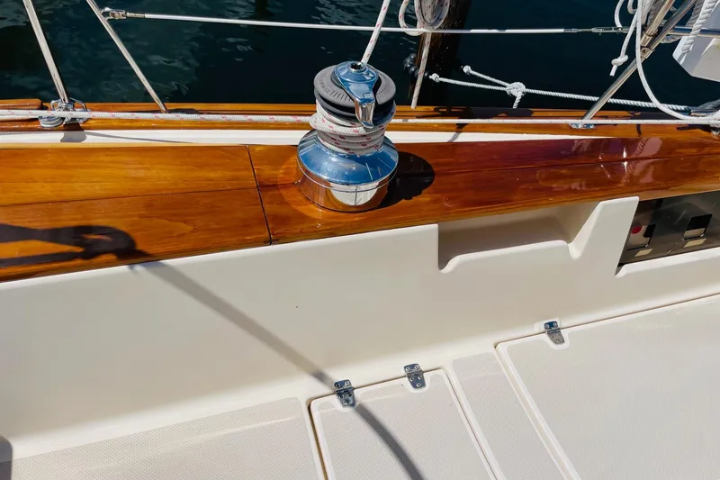 Slide: The Image of Polished winch on 2002 Island Packet 420 sailboat with wooden trim and white deck. - 22