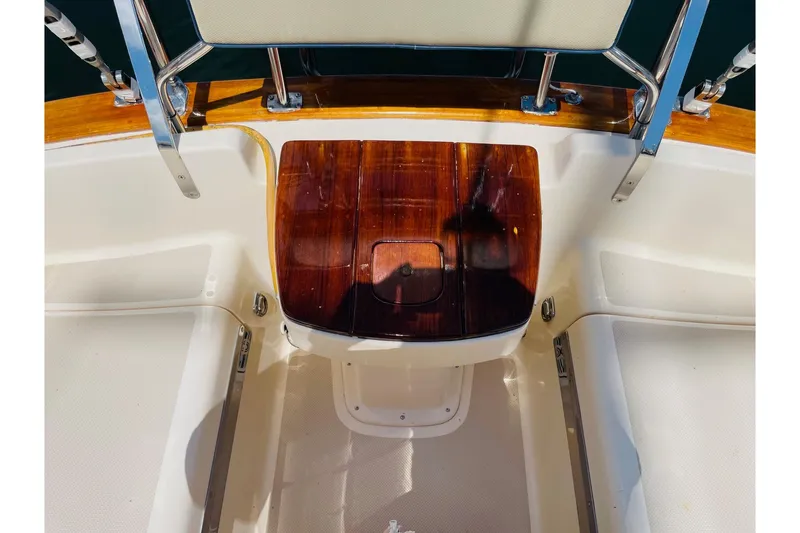 Slide: The Image of Cockpit of 2002 Island Packet 420 sailboat with polished wood and stainless steel details. - 25