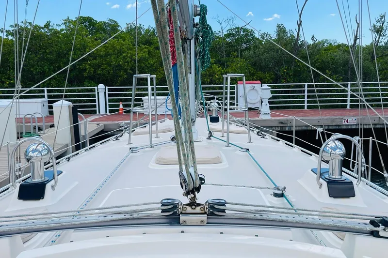 Slide: The Image of Deck view of a 2002 Island Packet 420 sailboat docked at a marina. - 27