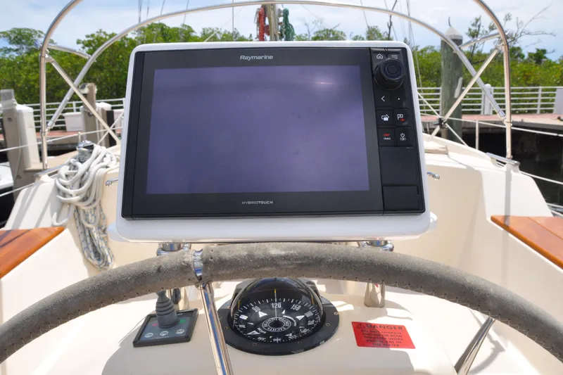 Slide: The Image of Steering console of 2002 Island Packet 420 sailboat with Raymarine navigation display. - 28