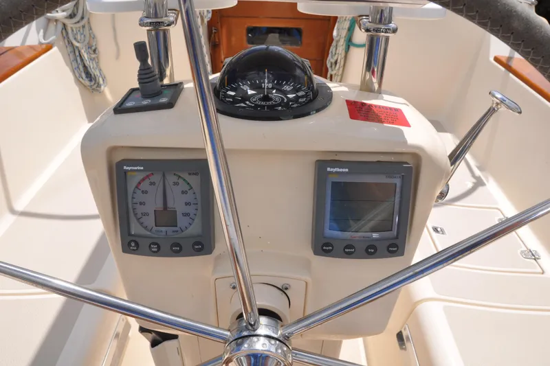 Slide: The Image of Steering console of 2002 Island Packet 420 sailboat with navigation instruments. - 29