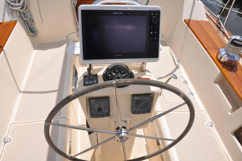 Slide: The Image of Steering wheel and navigation equipment on 2002 Island Packet 420 sailboat. - 30