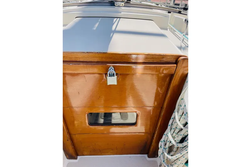 Slide: The Image of Wooden hatch with lock on 2002 Island Packet 420 sailboat deck. - 35