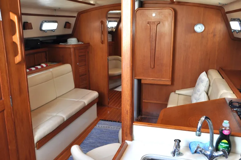 Slide: The Image of Interior of 2002 Island Packet 420 yacht with wooden finish and cozy seating. - 38