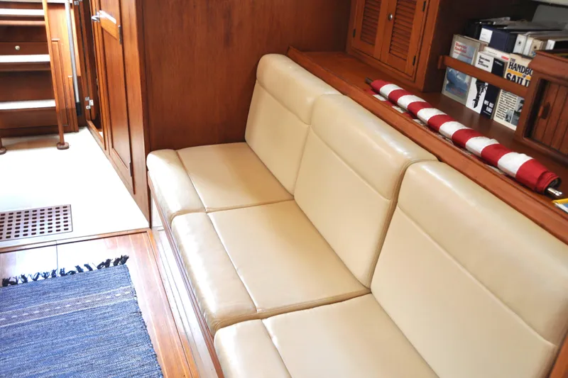 Slide: The Image of Interior of 2002 Island Packet 420 yacht with beige seating and wooden cabinetry. - 39