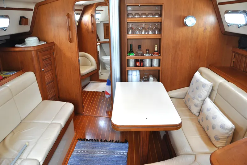 Slide: The Image of Luxurious interior of 2002 Island Packet 420 yacht with cozy seating and elegant wood finish. - 41