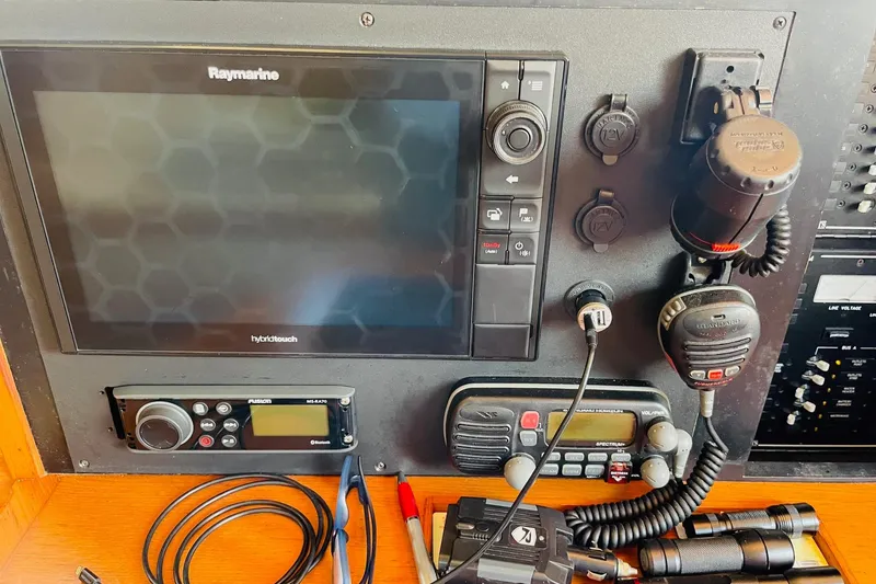 Slide: The Image of Control panel of a 2002 Island Packet 420 sailboat with navigation and communication equipment. - 47