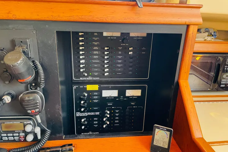 Slide: The Image of Control panel of a 2002 Island Packet 420 yacht with communication equipment. - 48