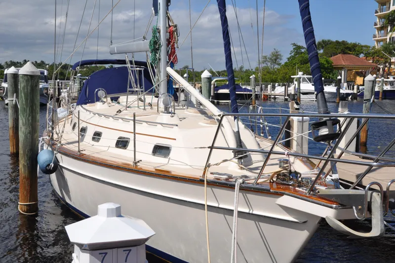 Slide: The Image of 2002 Island Packet 420 sailboat docked at marina, featuring classic design and sturdy build. - 5