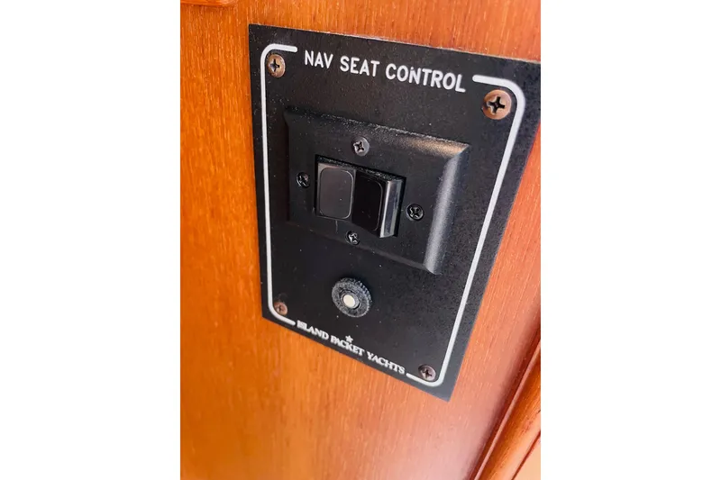 Slide: The Image of Nav seat control panel on 2002 Island Packet 420 yacht. - 50