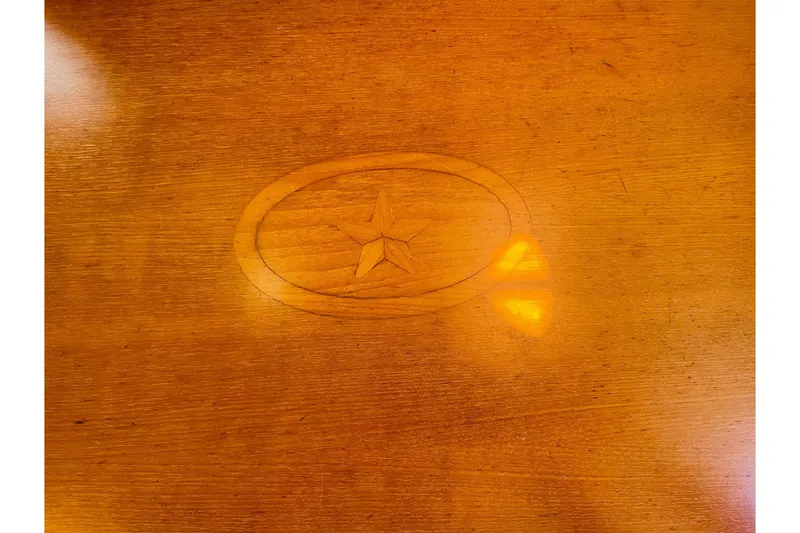Slide: The Image of Wooden surface with star emblem, Island Packet 420, 2002 model. - 51